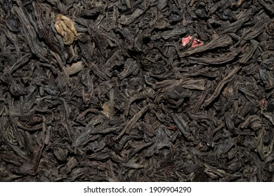 Close Up Of Dry Black Tea Leaves With Petals