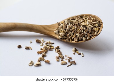 Close Up Of Dry Dandelion Root Tea Inside Wooden Spoon