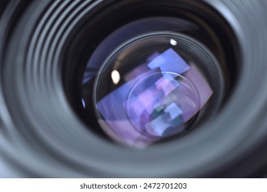 Close up of DSLR, SLR or Mirrorless camera lens and see through the lenses structure inside with also the reflection on lens surface.