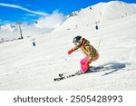 Close up Dynamic banner of woman skier on piste ski downhill fast motion in Alps. Active winter holidays, skiing downhill in overcast day. Ski rides on the track with swirls of fresh snow