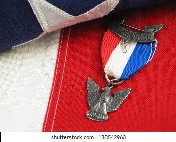 Close Up Of An Eagle Scout Award Sitting On A Flag