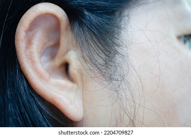 Close up ears Asian woman