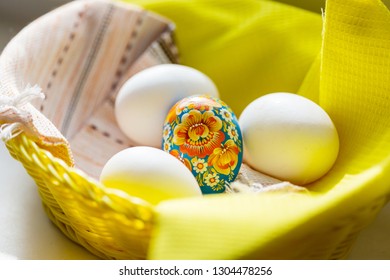 Close up Easter eggs in a basket. Spring easter background.