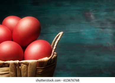 Close Up Of Easter Red Eggs In Basket