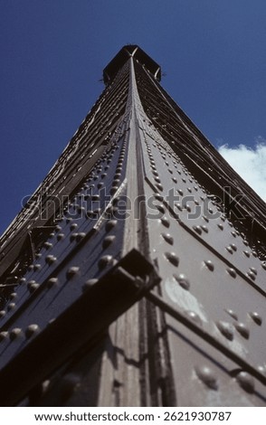 Close up of Eiffel Tower looking upward