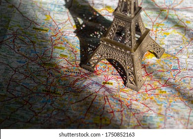 Close up of Eiffel tower on a map of Paris, for concept travel, France.