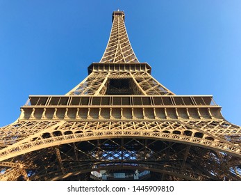 Close up of the Eiffel Tower from underneath at sunrise