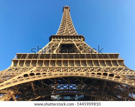 Close up of the Eiffel Tower from underneath at sunrise