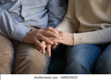 Close Up Elder Family Couple Sitting On Sofa, Holding Hands, Old Loving Married Man Supporting Wife, Mutual Understanding, Psychological Help, Comforting, Taking Care Of Each Other.