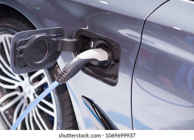 Close up of electric car being charging - Shutterstock ID 1069699937