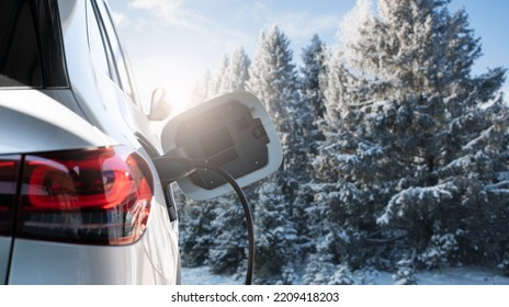 Close up of electric car inlet on a background of snowy winter forest - Powered by Shutterstock