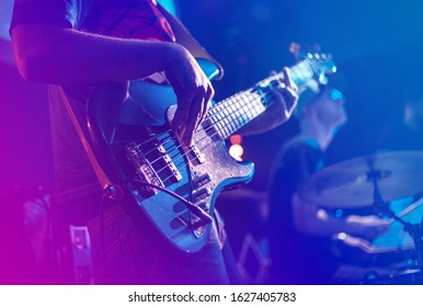 Close up of electric guitar during rock concert. - Powered by Shutterstock