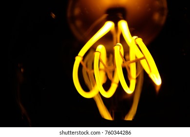 Close up of electric light bulb element fillament