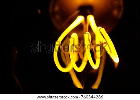 Close up of electric light bulb element fillament