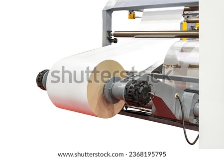 close up electric motor and paper roll sheet system for converting or feed paper of high speed automatic roll slitting and rewinder machine in industrial isolated on white with clipping path