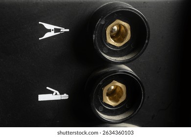 Close up of the electrode holder cable sockets and ground clamp of the inverter welding machine