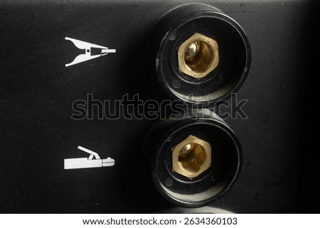 Close up of the electrode holder cable sockets and ground clamp of the inverter welding machine