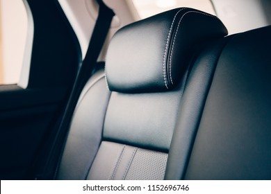 Close Up Of An Elegant Car Headrest Upholstered In Black Handmade Leather