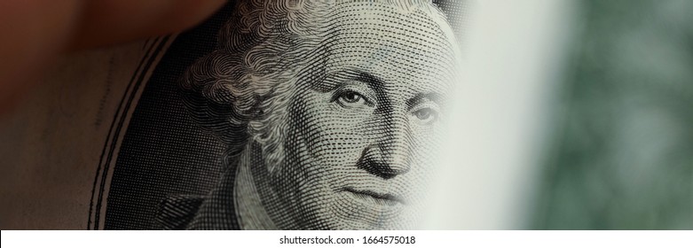 Close up element banknote with george washington. Automatic currency exchange online. Currency exchange, converter and currency calculator. Safe storage of cash. Business investment