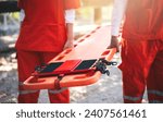 Close up of Emergency Rescue Team Holding Transfer Stretcher to Help Patient in Emergency Situation. Critical Medical Assistance and Rescue Services in Action