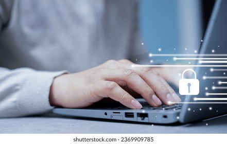 close up employee man hand use laptop to set security system with interface locked for data protection and digital authentication concept - Powered by Shutterstock