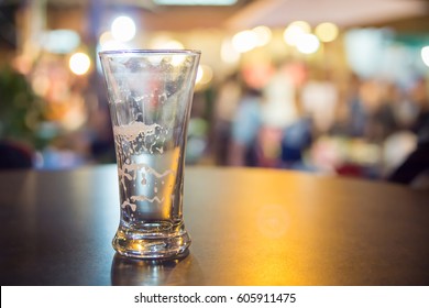 Close up of empty beer mug for after party on black table at bar table