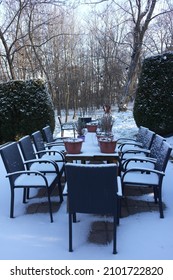 Close Empty Cafe Terrace, Outdoor Furniture Table With Chairs Covered With Fresh Snow.