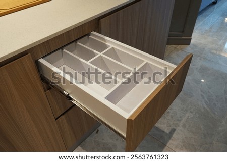 Close up of empty cutlery drawer.