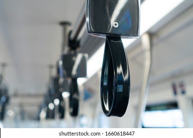 Close Up Of Empty Handrails In A Metro Subway Train , Handle Hand Straps In Public Transportation For Passenger Safety.