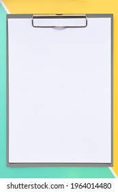 close up of empty paper on yellow and green background