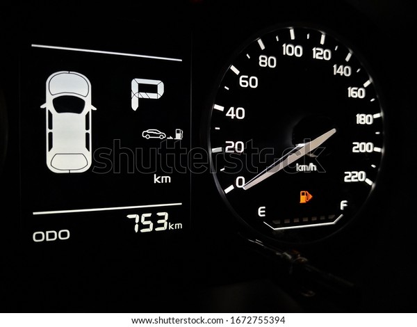 close up empty petrol, gasoline gauge dashboard in car\
with digital warning sign. low lavel of fuel show on speedometer\
dashboard. 