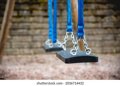 Close up of empty swing at playground.