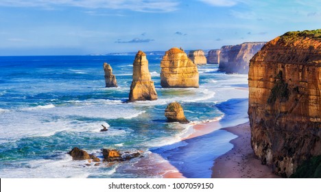 Close encounter of limestone rocks dubbed apostles in twelve apostles marine park on Great Ocean road in Victoria, Australia. Bright sunny day and calm blue ocean. - Powered by Shutterstock