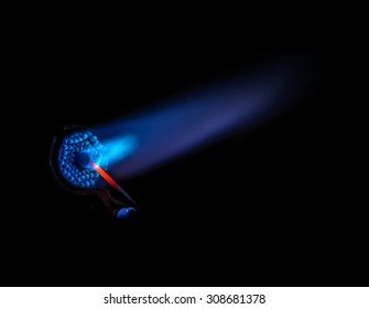 Close up of the end of a blowtorch with the blue flame