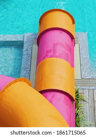 Close Up End Of Colorful Waterpark Slider In Hot Summer Day.