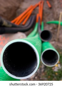 Close Up Of End Of Plastic Pipe In A Ditch