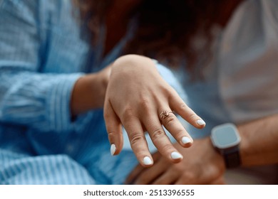 Close up of engagement ring on woman's hand.  - Powered by Shutterstock