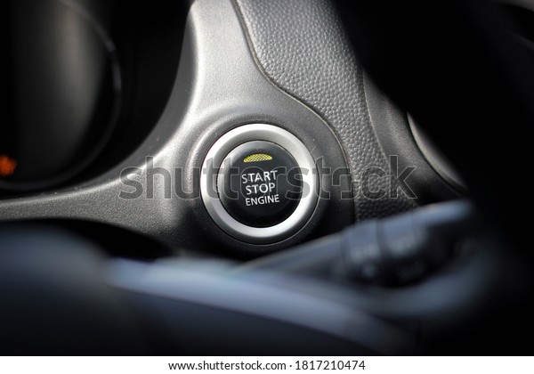 Close up engine car start button.\
Start stop engine modern new car button,Makes it easy to turn your\
auto mobile on and off. a key fob unique ,selective\
focus