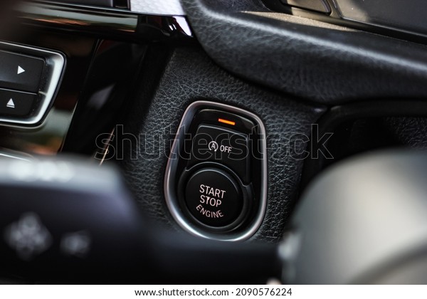 Close up engine car start button.\
Start stop engine modern new car button,Makes it easy to turn your\
auto mobile on and off. a key fob unique ,selective\
focus