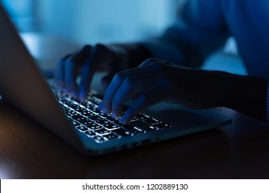 close up engineer employee man hand typing keyboard input code for register system structure or unlock password on laptop in dark operation room for cyber security and work from home concept - Powered by Shutterstock