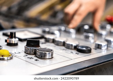 close up engineer hand finger press button controling cnc machine, Workers operating factory machinery in warehouse - Powered by Shutterstock