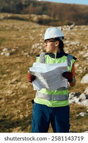 Close up of an Engineer Reviewing Project Papers for the Construction of Wind Turbines 