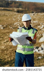 Close up of an Engineer Reviewing Project Papers for the Construction of Wind Turbines 