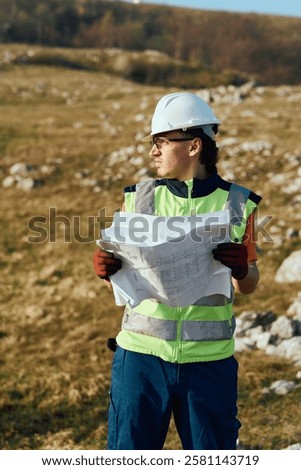 Close up of an Engineer Reviewing Project Papers for the Construction of Wind Turbines 