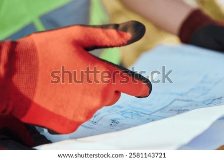 Close up of an Engineer Reviewing Project Papers for the Construction of Wind Turbines 