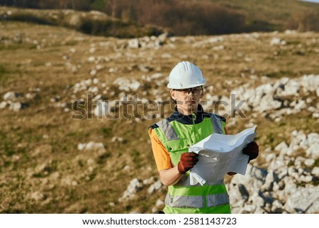 Close up of an Engineer Reviewing Project Papers for the Construction of Wind Turbines 