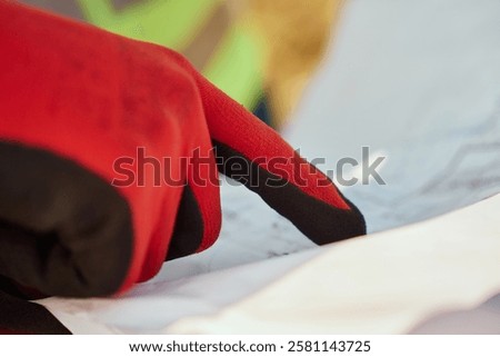 Close up of an Engineer Reviewing Project Papers for the Construction of Wind Turbines 