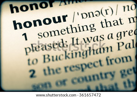 Close up of English dictionary page with word honour