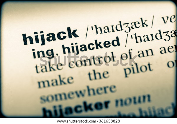 Close up\
of English dictionary page with word\
hijack