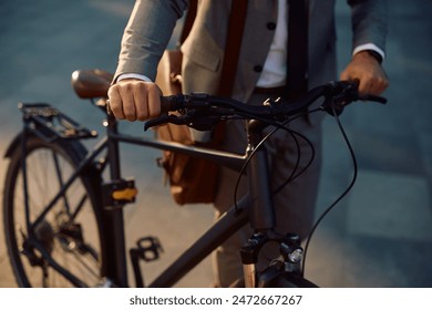 Close up of entrepreneur using bicycle while commuting to work.  - Powered by Shutterstock